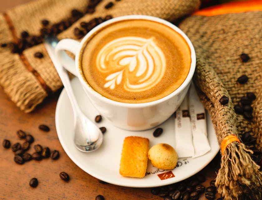 A beautifully presented frothy cup of coffee served at a coffee and tea business.