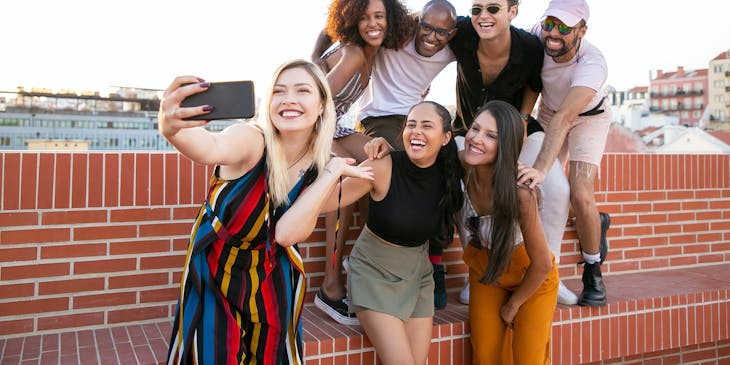 A cheerful group of friends posing for a photograph.