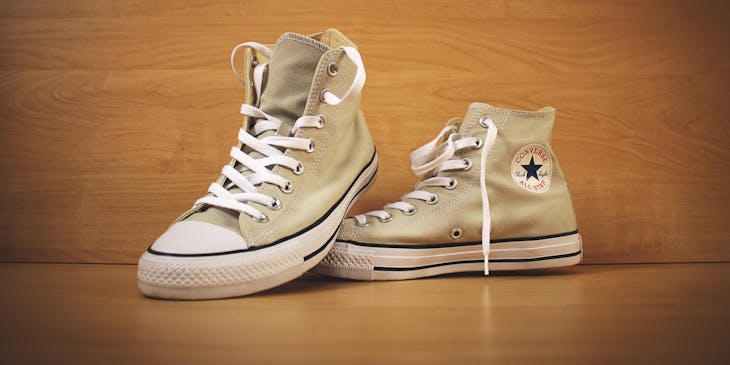 A pair of brown Converse shoes.