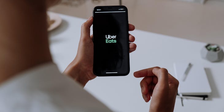 A person ordering food from a virtual restaurant through the Uber Eats mobile app.