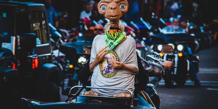A 20th century figurine of ET on the back of a motorcycle.