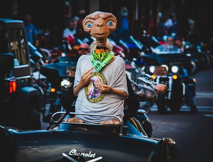 A 20th century figurine of ET on the back of a motorcycle.