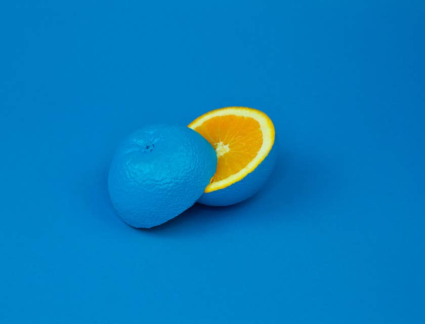 A painted blue lemon sliced in two.