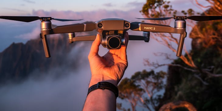 Person holding a drone.