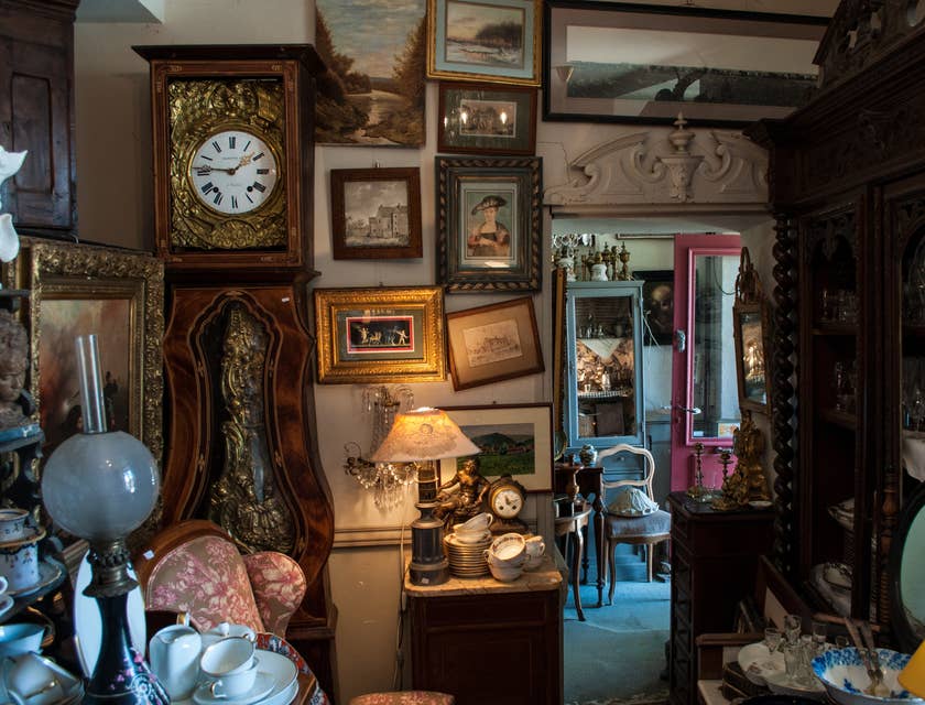 antique store with furniture, pictures, and glasswear