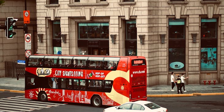 Red double-decker tour bus on an architectural tour.