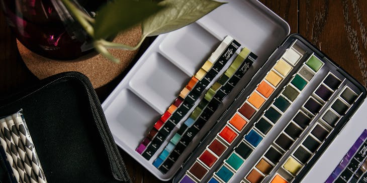 Art supplies on a desk.