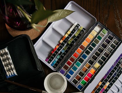 Art supplies on a desk.