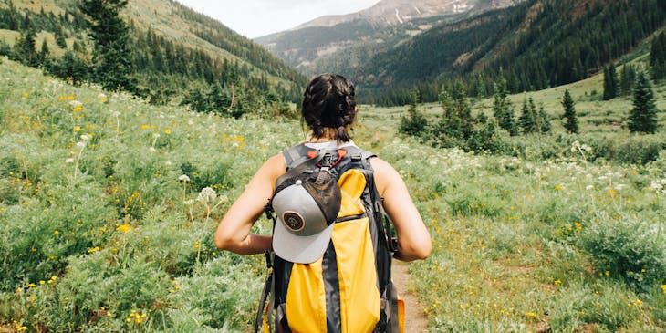 woman carrying backpack on her back