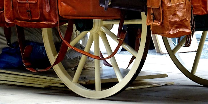 Cart filled with various bags.