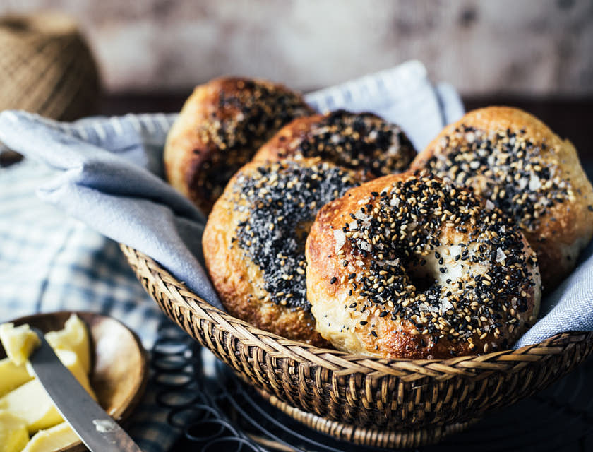 Bagels in a basket at a bagel shop.