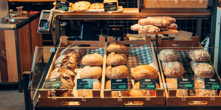 Assorted breads on display in a bakery business.