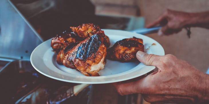 Chicken being grilled in a bar and grill business.