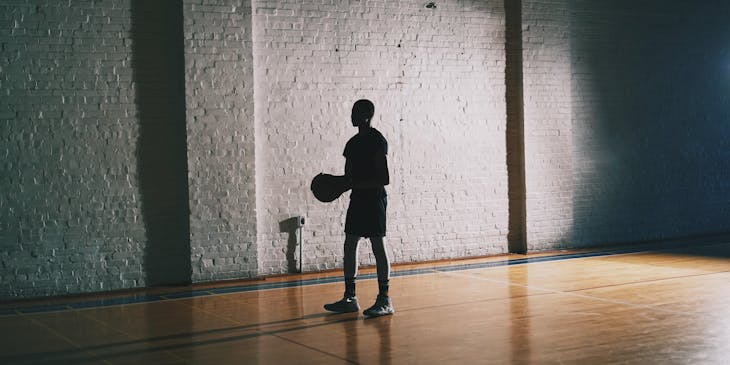 A young man at a basket training center.