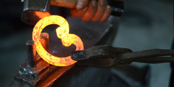 A blacksmith shaping metal.