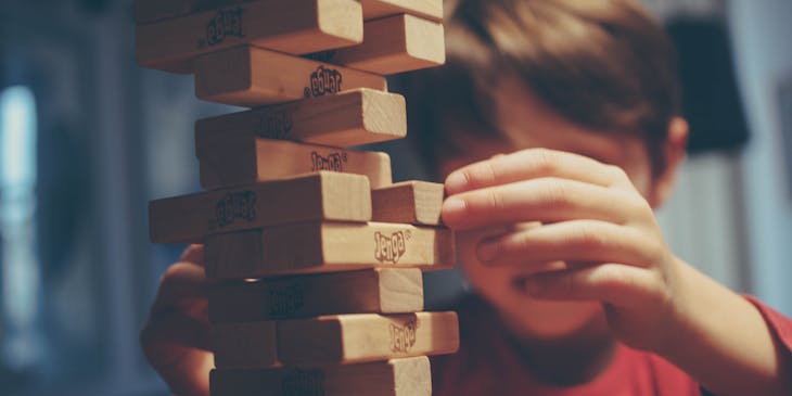 Child playing a board game.