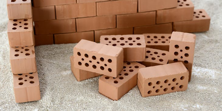 A pile of bricks ready for use by a bricklaying business.