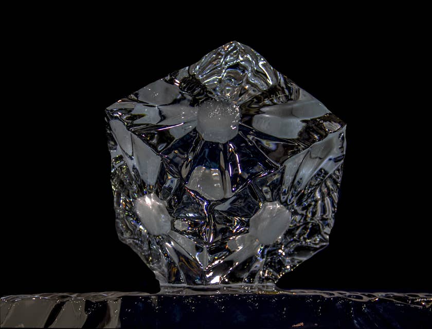 An ice cube reflecting brilliant light.