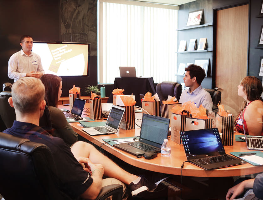 Business consultant pitching to business owners.