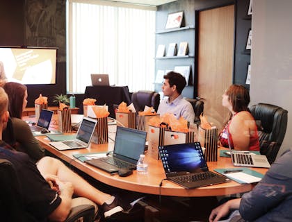 Business consultant pitching to business owners.