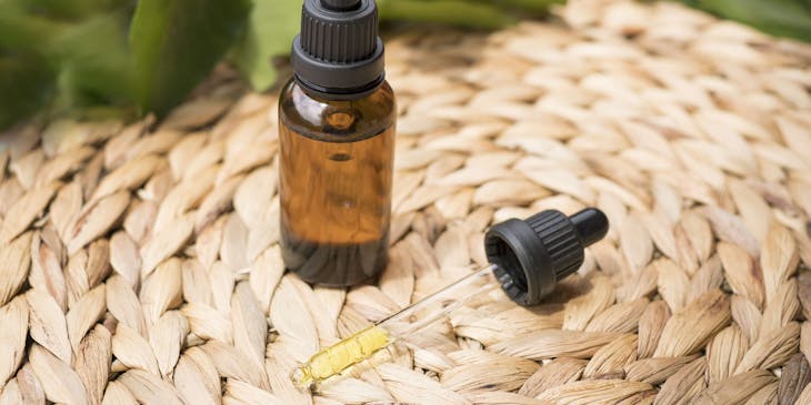 CBD (cannabidiol) oil drops in a vial.