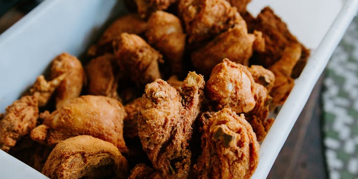 Fried chicken pieces served at a chicken shop business.