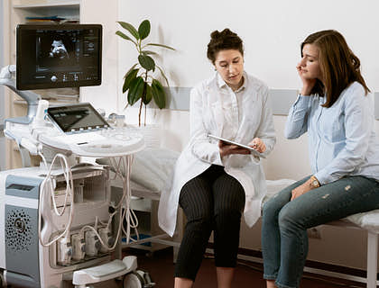 A doctor at a clinic talking to a patient.