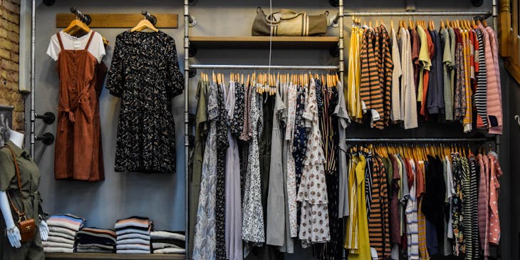 Clothes for sale in a clothing store.