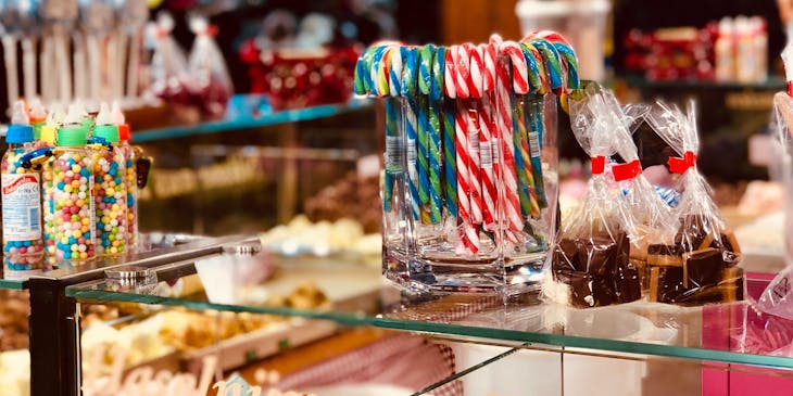 A concession stand business with displays of candies and treats.