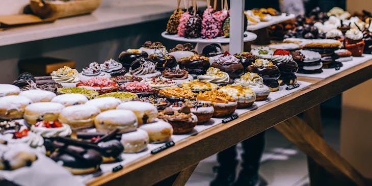 A display of confectionary treats such as donuts and tarts.