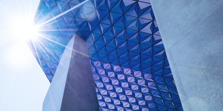 The sun glinting off a contemporary building.