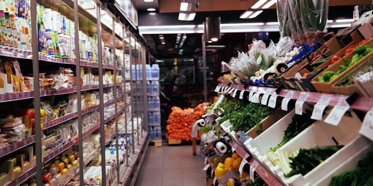 Refrigerated products and fresh produce on display in a convenience store.