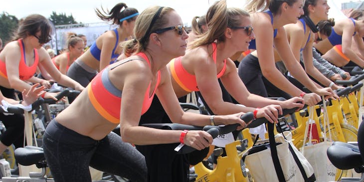 Women partaking in a cycling class.