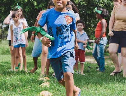 Children playing an outdoor game at day camp.