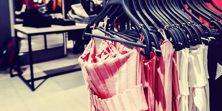A rack of clothing in a department store.