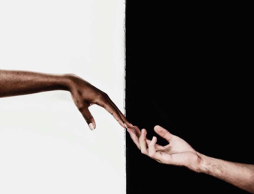 two hands reaching