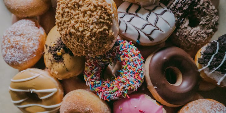 Assorted donuts in a donut shop.