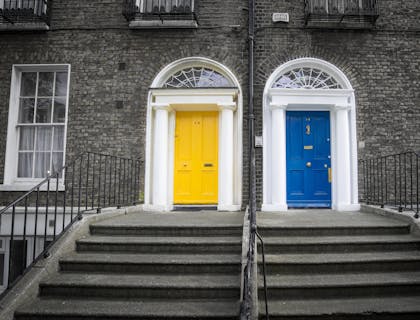 Blue and yellow doors in front of building.