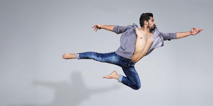 A dancer performing a dynamic movement.