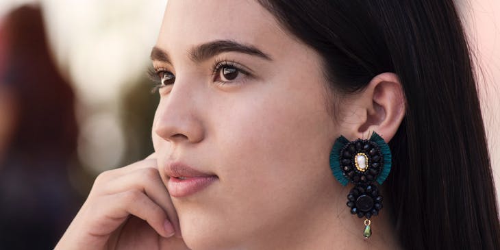 Woman wearing an earring in one ear.