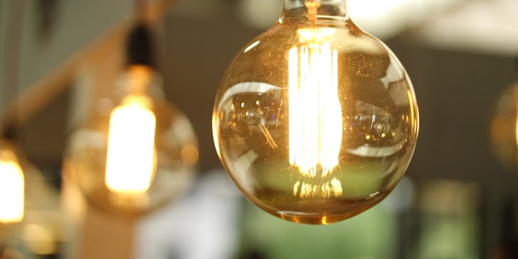 Electrical lightbulbs hanging from the ceiling.
