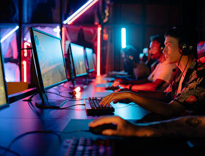 A group of esports gamers playing a match.