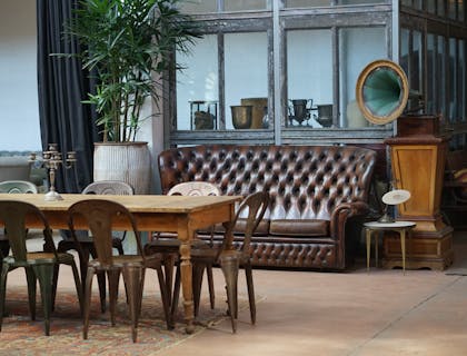 Antique furniture on display at an estate sale.