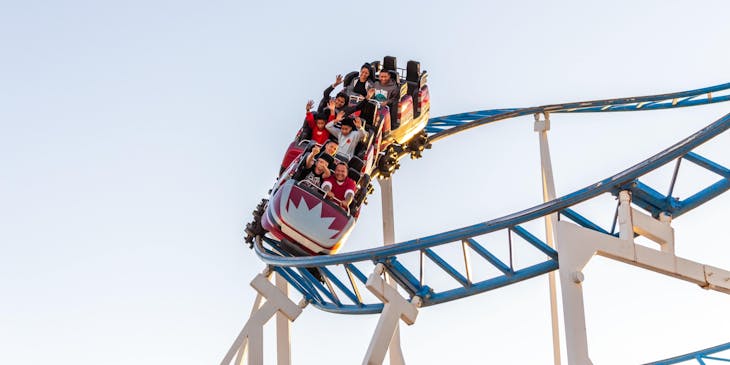 A group of people on an exciting roller coaster ride.