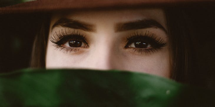 A person with long lashes after having an eyelash service done.