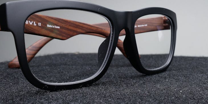A pair of spectacles on a table at an eyewear and optician business.