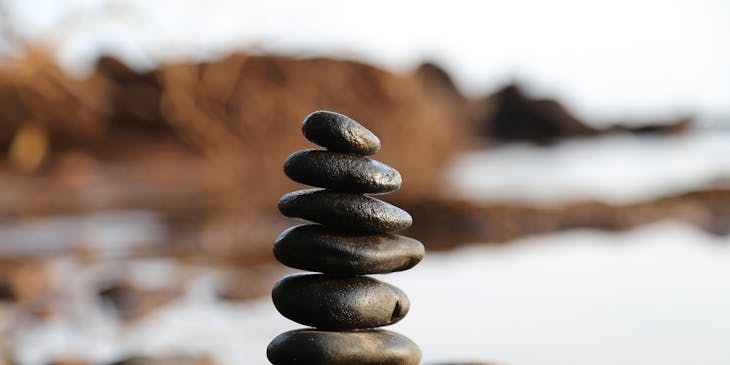 Meditation stones placed in a perfectly balanced stack for feng shui.