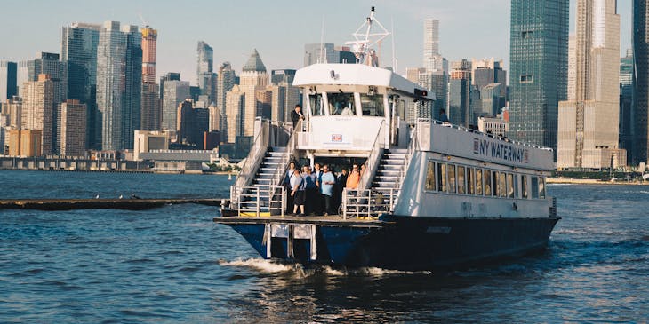 A ferry from a ferry business crosses a channel.
