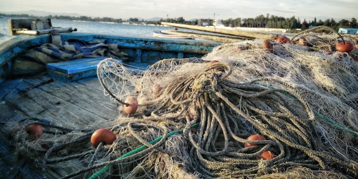Fishing nets lying on the bow of a boat.