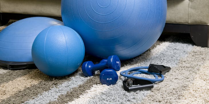 Blue yoga balls, weights, and ropes at an exercise/fitness business.
